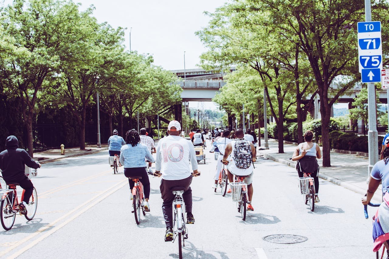 Cyclists enjoying a group ride on a sunny day in downtown Cincinnati.